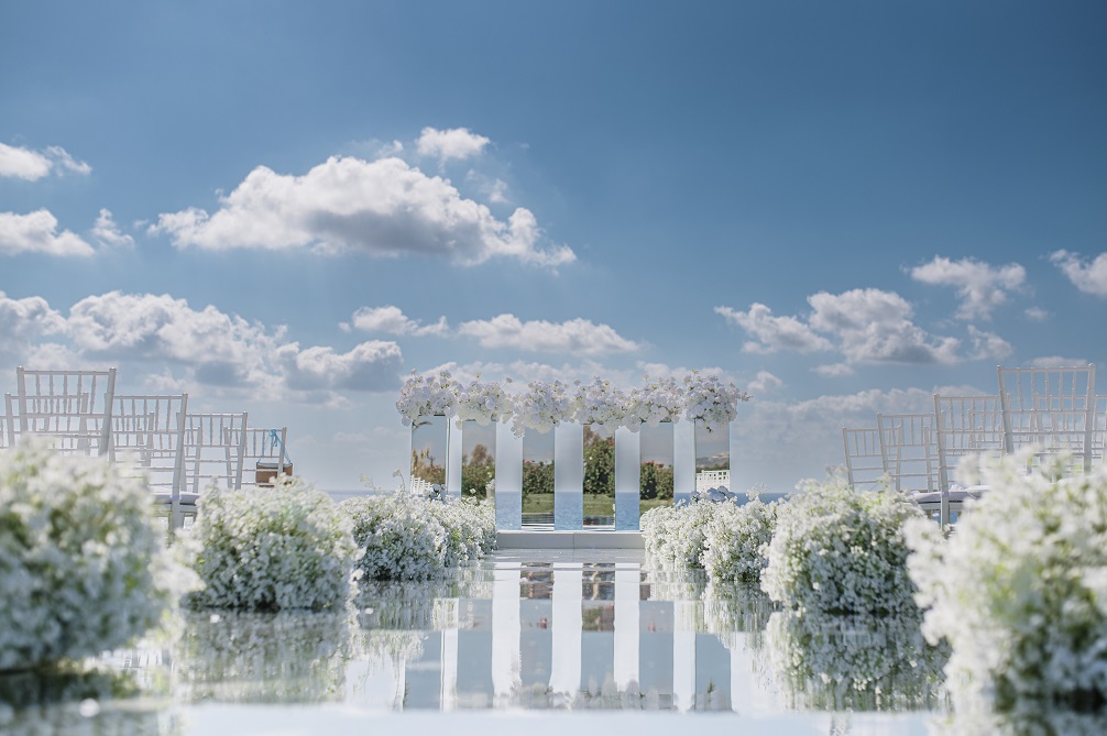 Mirror wedding aisle with gypsophila flower arrangements in Paphos Cyprus